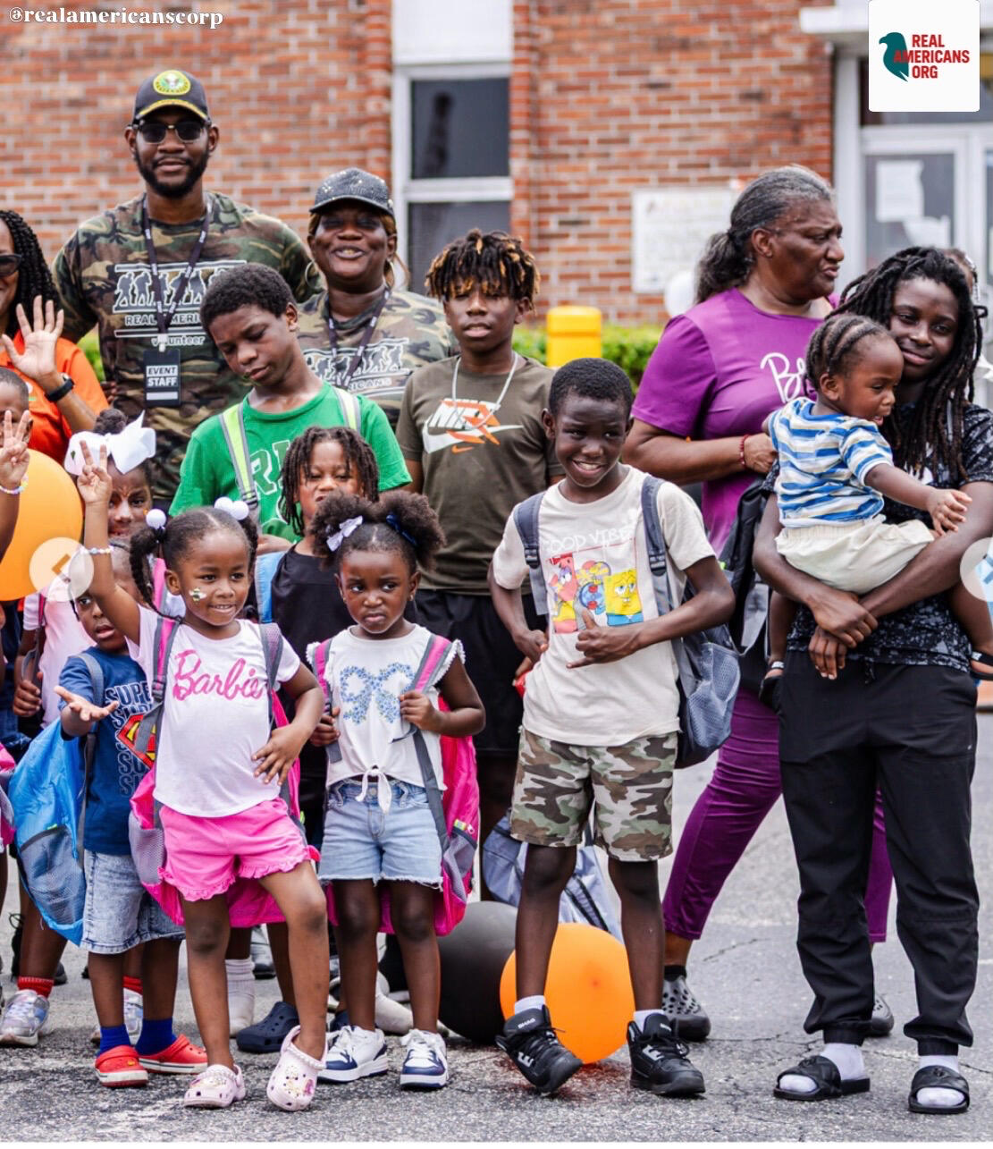 REAL AMERICANS CORPORATION – Students Receive Backpacks and School Supplies REAL AMERICANS CORPORATION – Students Receive Backpacks and School Supplies